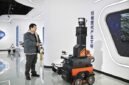 A staff member of Tianjin Siasun Intelligent Technology operates a mine inspection robot in the Beijing-Tianjin Zhongguancun Tech Town in Tianjin.